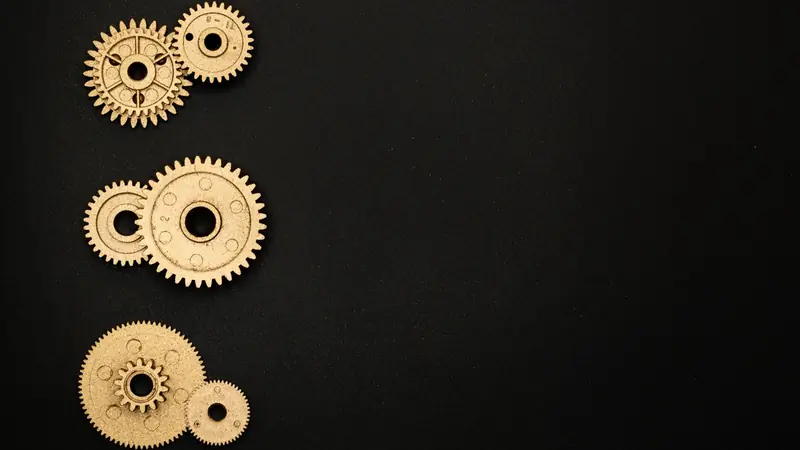 Interlocking brass gears inside a clockwork mechanism