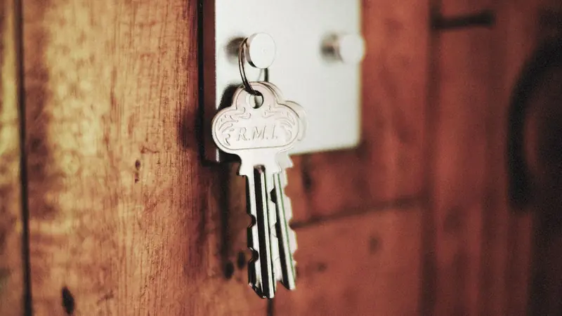 An old iron key resting in a lock