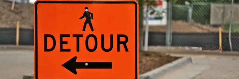 A diversion road sign directing traffic onto another route