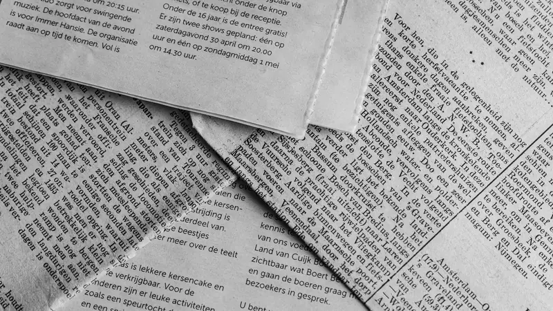 A newspaper page photographed close up, showing columns of text