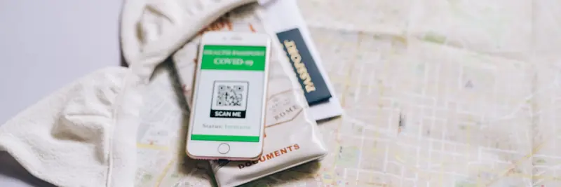 A smartphone camera scanning a QR code on a printed sign