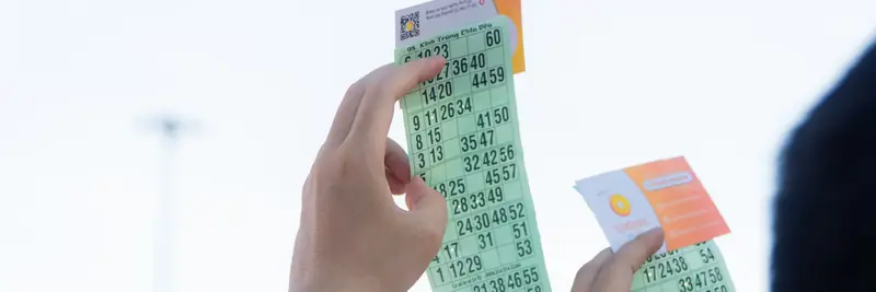 Numbered lottery balls tumbling in a draw machine