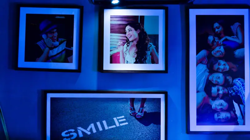 Framed pictures arranged on a gallery wall