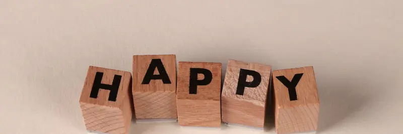 Wooden alphabet blocks scattered across a table