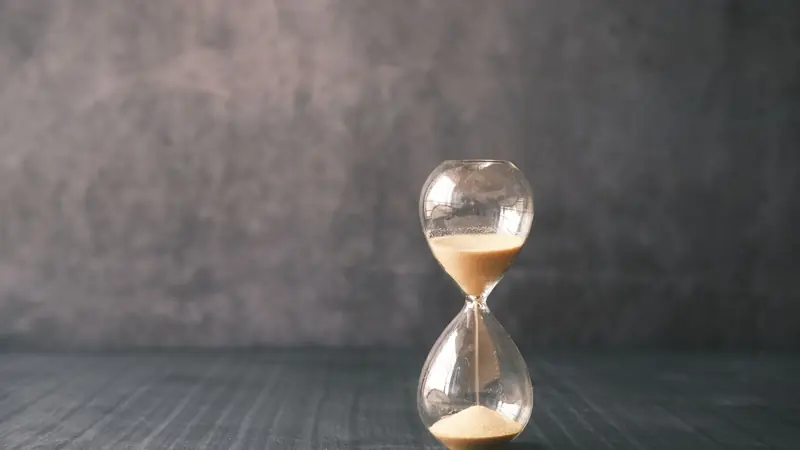 A stopwatch held in an outstretched hand